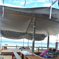 To sit at a table with a plank of wood balanced on two milk crates for seats costs &#165;500 per person. | AMY CHAVEZ