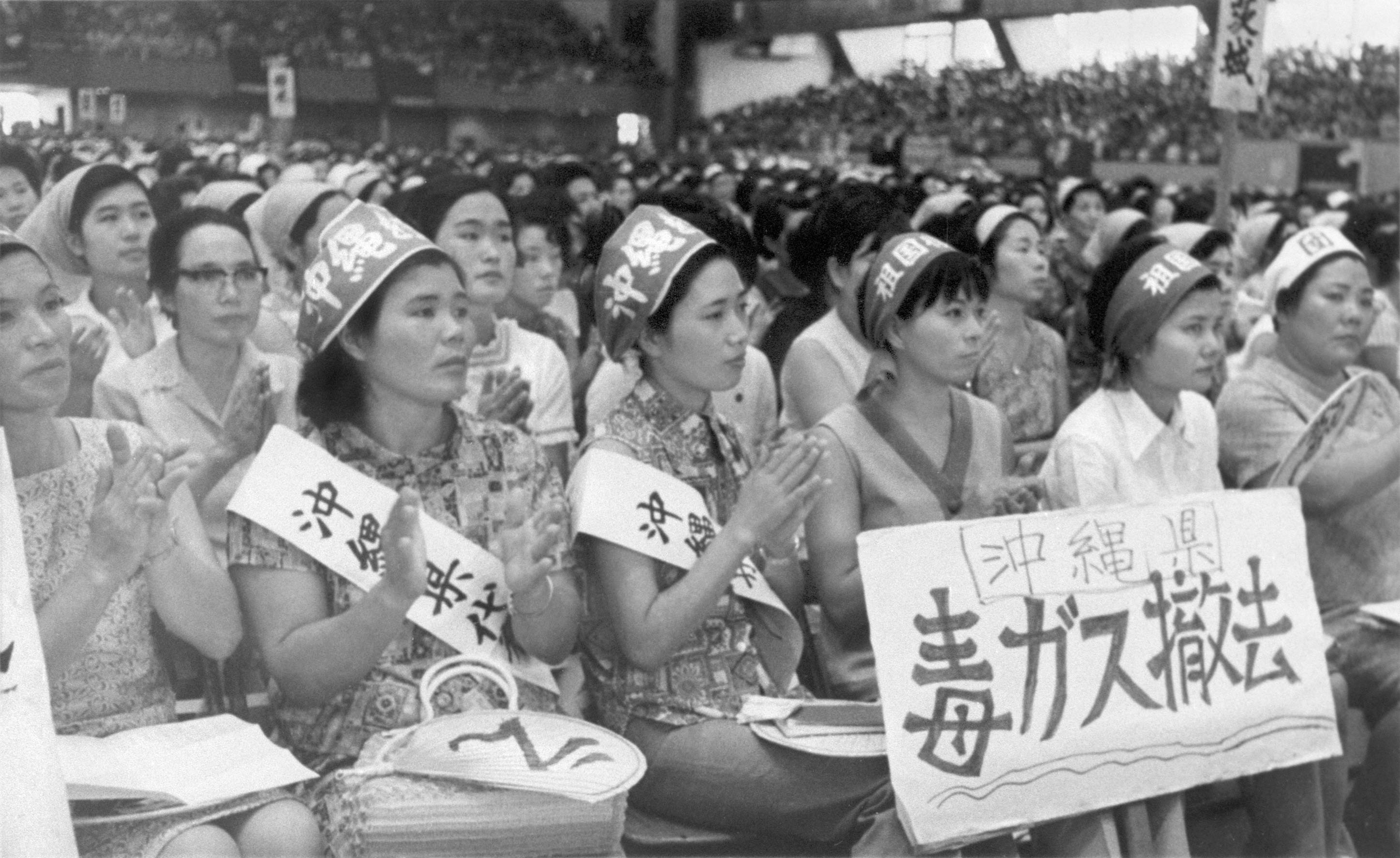 Okinawan women hold placards reading 'Remove poison gas' at a Japan Mothers Association meeting in 1969 in Tokyo, just weeks after a poison gas accident at a U.S. installation on the island.  | KYODO