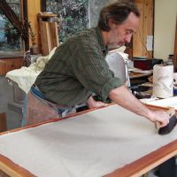 Keeping traditions alive: Washi (traditional Japanese paper) craftsman Rogier Uitenboogaart places sheets of the paper he has made onto a board before drying them under the sun. | COURTESY OF ROGIER UITENBOOGAART