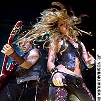 Shakira lets it all hang out during a recent performance for the Japanese press at Tokyo\'s Akasaka Blitz. | (c) PAXTON IMAGES (middle and bottom)/ ALISON LESLIE PHOTO (top)