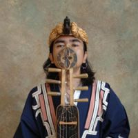 Don\'t fret: Oki stands with a rare six-string tonkori, which is said to resemble the shape of a woman. | DANIEL ROBSON PHOTO