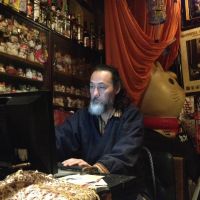 Smooth networking: Jiken Miyazaki updates the website of his jazz cafe Samurai. Cafe owners are increasingly trying new ways to attract younger customers. | JAMES CATCHPOLE
