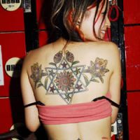 Showing skin: A client of Osaka-based tattoo artist Kozuru at a tattoo event. The number of women in Japan getting tattoos appears to be on the rise. | JOHN HARTE PHOTO