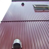 Cosmetic choices: Galvanium siding, samples of cement-fiber siding (below) and a recently painted mortar-and-tile exterior of a 1975 house (bottom). | PHILIP BRASOR AND MASAKO TSUBUKU