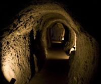 History’s depths: The main tunnel of the Ryugenji Shaft (above), part of the World Heritage-listed Iwami Ginzan silver mine. Below: Wooden beams that once supported working platforms for miners can still be seen in the Okubo Shaft. Descending into the somber history of a once-glittering prize