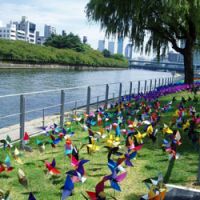 Among the \"Aqua Metropolis Osaka\" festival\'s attractions are a field of pinwheels by the Tosabori River; a workshop where visitors can make trendy sandals from old soccer boots. | &#169; CIRQUE DU SOLEIL