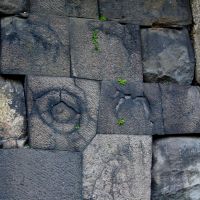 Burnt offerings: Stones at the Chujakumon Gate bearing the scars of Edo Castle fires. | DWANGO CO.