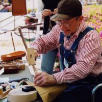 Bags of skill: A leather-worker plies his trade at the fair. | CRAFTS FAIR MATSUMOTO