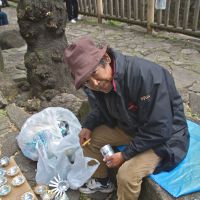 Cash for ash: Rikuro Miyake with some of the &#165;100 ashtrays he makes from cans. | WINIFRED BIRD