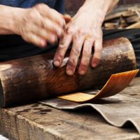 Roll calls: A craftsman (above) curves lacquerware the traditional way; and some of the 200 Nakasendo Jizo statues gathered at Narai. | MARK BRAZIL