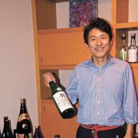 Rich pickings: Mein (sake-tasting) host Shunji Shinoda at Isego Honten, and part of the breads bonanza to be had at Parito Fuwato. | KIT NAGAMURA PHOTOS