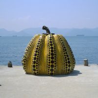 Seaboard gourd: Yayoi Kusama\'s \"Pumpkin\" stands taller than a man. A red version also stands near the dock at Miyanoura. | STEPHEN MANSFIELD PHOTOS