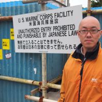 The camp, described as an anachronism of the Cold War, has long been the target of protest demonstrations; Buddhist monk Kobun Sasaki characterizes the struggle as a \"human rights\" issue. | EDAN CORKILL