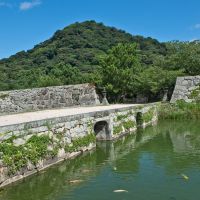 Living history: Hagi Castle (above), now merely a beautiful ruin; and a \"samurai\" volunteer strolls a nearby lane. | STEPHEN MANSFIELD
