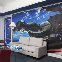 Bed and \'bot: A guest room at the Grand Pacific Le Daiba hotel features illustrations from the popular \"Gundam\" animated series. | GRAND PACIFIC LE DAIBA
