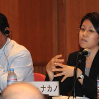 Jane Nakano (right) from the Center for Strategic and International Studies talks about global demand for nuclear energy during a June 13 seminar in Tokyo while Akihiro Sawa with the 21st Century Public Policy Institute listens. | SATOKO KAWASAKI