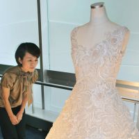 Knit one pearl two: A woman looks at a dress inlaid with more than 13,000 pearls on display at the Mikimoto &amp; Co. outlet in Nagoya on Friday. | KYODO