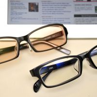 A sight for sore eyes: Computer glasses, either with brown-tinted lenses (top) or clear lenses, are apparently helping to cut the amount of eye exposure to blue light emitted from electronic screens. | YOSHIAKI MIURA