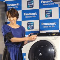 Just add detergent: Actress Michiko Kichise shows off a new washing machine that can be connected to a smartphone at a Panasonic Corp. press event Tuesday in Tokyo. | KAZUAKI NAGATA