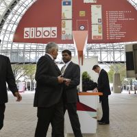 Networking: Participants attending the Sibos international gathering of banking and financial leaders walk in the atrium of the Intex Osaka conference hall in Suminoe Ward, Osaka, when the four-day gathering kicked off Monday. | KYODO