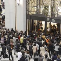 Good as new: Shoppers enter Hankyu\'s flagship in Umeda, Osaka, on Wednesday. All the retail space is now open in the emporium, which began to undergo refurbishment in 2005. | KYODO