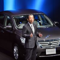 A new car: Nissan Motor Chief Operating Officer Toshiyuki Shiga debuts the Sylphy sedan Wednesday at the firm\'s head office in Yokohama. | AFP-JIJI