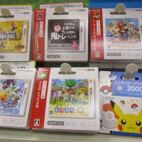 Pay and play: Download codes for digital versions of popular Nintendo games for sale at a convenience store in Osaka. Despite downloadable versions, packaged games in high demand