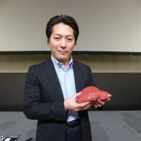 Organ donor: At an academic conference in Tokyo last month, Dr. Maki Sugimoto displayed a model of a human liver made partly on a 3-D printer. | SATOKO KAWASAKI
