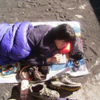 Happy camper: Chiaki Kato sleeps under the sky on Oshima Island, part of Tokyo, in 2007. | COURTESY OF CHIAKI KATO
