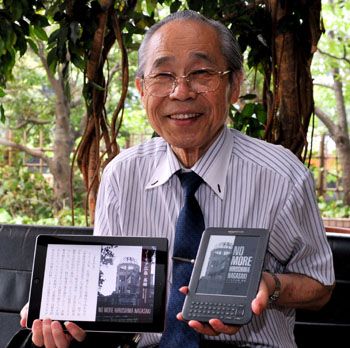 Spreading the digital word: Takuma Fukuyama displays the digital version of his book “No More Hiroshima Nagasaki” on his iPad 2 and Kindle e-reader during an interview in late July with The Japan Times in Tokyo. War memoirs digitized for posterity