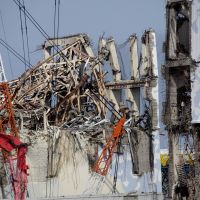 Holding the line: Wrecked reactor buildings 3 (left) and 4 are seen at Tokyo Electric Power Co.\'s Fukushima No. 1 nuclear power station in the town of Okuma, Fukushima Prefecture, on Feb. 28. | POOL