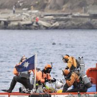 Search and recover: Coast guard divers join a three-day intensive search for the remains of people missing since the March 11 tsunami in the port of Miyako, Iwate Prefecture, on Friday. | KYODO