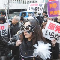 From tears to rage: Antinuclear protesters take to the streets of Tokyo on Sunday after holding a rally in Hibiya Park in Chiyoda Ward. | SATOKO KAWASAKI
