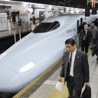 Business class: Travelers get off a shinkansen at JR Hakata Station in Fukuoka Prefecture on Monday. | KYODO