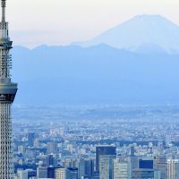 Riding high: The 634-meter-tall Tokyo Skytree towers above Sumida Ward on Jan. 1 against the backdrop of Mount Fuji. | KYODO