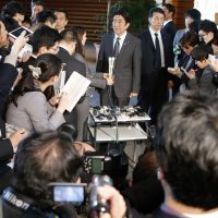 Playing it safe: Prime Minister Shinzo Abe speaks at the prime minister\'s office on Jan. 22. | AP