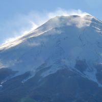 Under the volcano: White wisps swirl around Mount Fuji as seen from Fujiyoshida, Yamanashi Prefecture, on Jan. 18. | KYODO