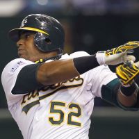 Power display: Athletics outfielder Yoenis Cespedes smacks a two-run home run in the seventh inning off Mariners reliever Shawn Kelley on Thursday at Tokyo Dome. Oakland beat Seattle 4-1. | AP