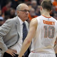 In his element: Syracuse head coach Jim Boeheim, interacting with guard Trevor Cooney during a recent game, has had a profound impact on the basketball career of Gunma head coach Ryan Blackwell. | AP
