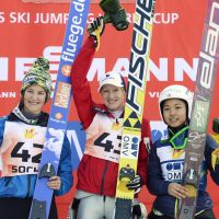 Third-place finisher Sara Takanashi poses with Austria\'s Daniela Iraschko (center), who tied with France\'s Coline Mattel for the gold at the women\'s ski jumping World Cup in Sochi, Russia. | KYODO