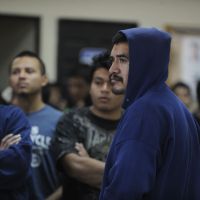 In limbo: A group of 375 Guatemalan would-be migrants who were deported from different parts of the U.S. wait to be registered by migration authorities upon their arrival at the U.S. Air Force base in Guatemala City on Dec. 28. | AFP-JIJI