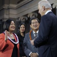 Capitol gain:  Vice President Joe Biden administers the Senate oath to Sen. Mazie Hirono, a Hawaii Democrat, accompanied by her husband, Leighton Kim Oshima, during a mock swearing-in ceremony on Capitol Hill on  Thursday. | AP