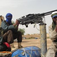 Holy warriors: Fighters from the Islamic group Movement for Oneness and Jihad in West Africa, one of several islamist groups fighting in Mali, guard Gao Airport in August. | AFP-JIJI