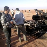 Charred remains: Men inspect the gutted wreckage of a vehicle near the Ain Amenas gas complex in Algeria. | AP