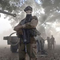 Angel of death?: A French soldier wearing a skeleton mask stands next to an armored car in Niono, Mali, on Sunday. | AFP-JIJI