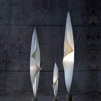 Designer Ingo Maurer (bottom) designed the lamps \"Wo-Tum- Bu\" (1998) as part of his series \"MaMo Nouchies,\" which was inspired by Japanese-American sculptor Isamu Noguchi | TOM VACH PHOTO (top)