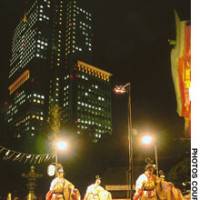 A quartet of silk-robed dancers on stage with the Sanno Park Tower behind. | (c)IMAGES OF JAPAN