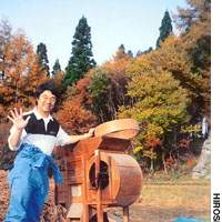 Hiroshi Sakoda, whose idea it was to brew and distill shochu using local buckwheat, husks the grains (above) to prepare them for the still. | INTERNATIONAL CELLO ENSEMBLE SOCIETY PHOTO