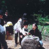 Eiji\'s daughter Yume, his older sister and grandson at the memorial stone in our Afan woods. | JEFF KINGSTON PHOTOS