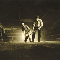 Sweet memory: Spreading water-soaked barley in the malting loft in 1986. | C.W. NICOL